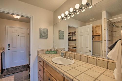 a bathroom with a sink and a large mirror at 2-Condo Property with Mtn Views by Golf and Ski Resort in Eden