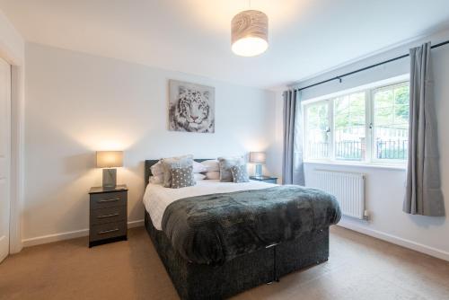 a bedroom with a bed and a window at No 14 in Mansfield