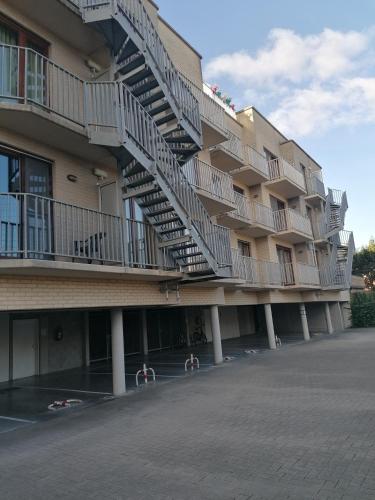 a large building with stairs on the side of it at Apartment Martine in Ostend