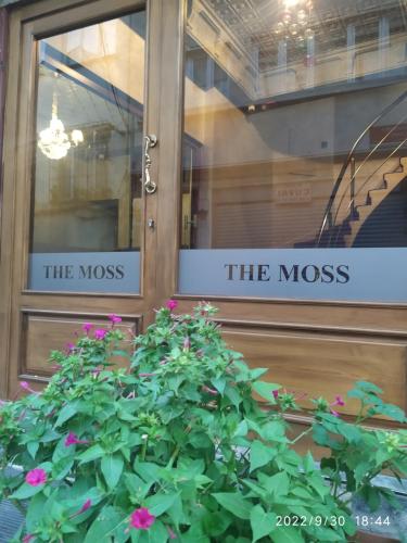 a door with the moss sign and a plant at THE MOSS Hotel in Istanbul