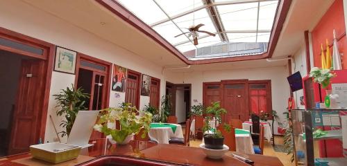 a room with a lot of plants and a ceiling at HOTEL LA REPUBLICA MANIZALES in Manizales