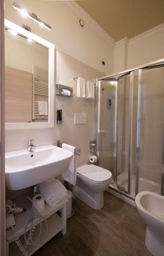 a bathroom with a sink and a toilet and a shower at Bed Bra in Verona
