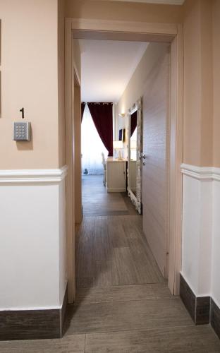 a hallway with white walls and wood floors at Bed Bra in Verona