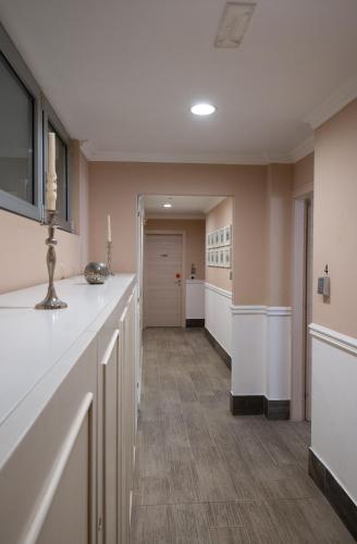 a hallway with a long counter in a room at Bed Bra in Verona