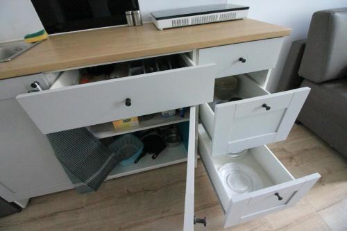 a desk with two drawers and a toilet in a room at Ali4 in Sosnowiec