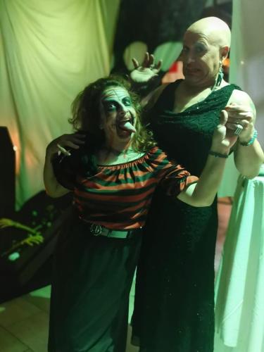 two women dressed in costumes posing for a picture at Eleni Apartments in Hersonissos