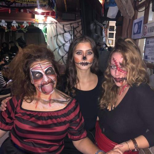 three women dressed up in zombie makeup posing for a picture at Eleni Apartments in Hersonissos