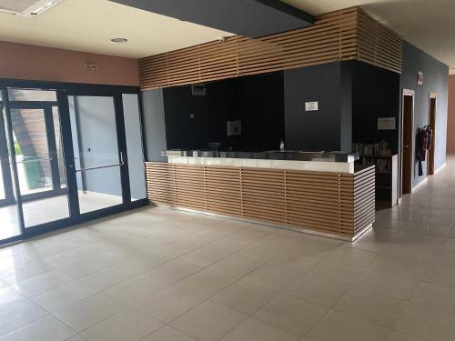 a lobby with a counter in a building at Cosy studios with mountain view near Bansko in Razlog
