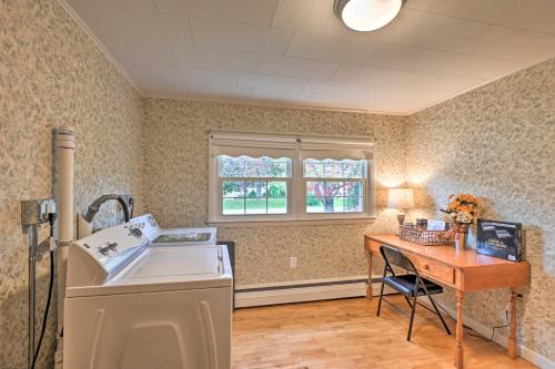 a laundry room with a sink and a table at Cottage 3 Miles to Dwntwn and Bangor Waterfront 