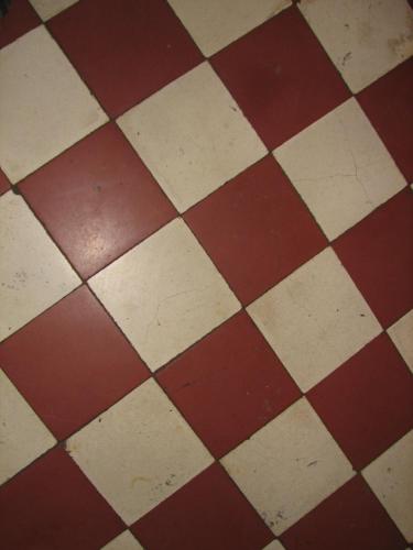 a close up of a checkered floor at Logis hôtel Arbez Franco Suisse in Les Rousses
