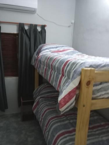 Postel nebo postele na pokoji v ubytování Temporarios Caseros SDE
