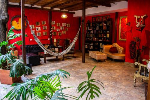 a room with a hammock in the middle of a room at Refugio del Jaguar in Medellín