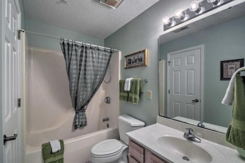 a bathroom with a sink and a toilet and a shower at Coastal Golf Resort Condo Less Than 4 Mi to Beach! in North Myrtle Beach