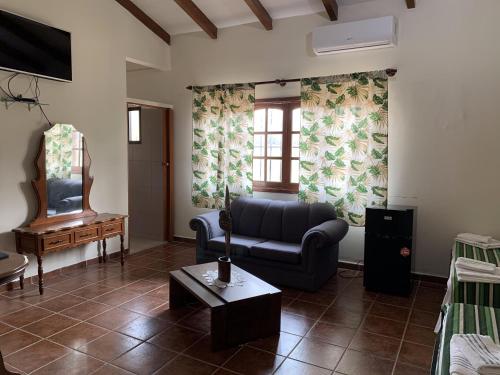 a living room with a couch and a table at Lili's Hostel in Santa Cruz de la Sierra