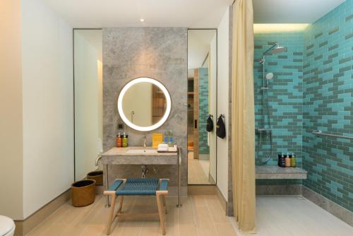 a bathroom with a sink and a mirror at Holiday Inn Resort Samui Bophut Beach by IHG in Bophut 