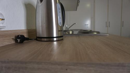 a coffee maker sitting on top of a kitchen counter at M&M Apartment Düsseldorf in Neuss