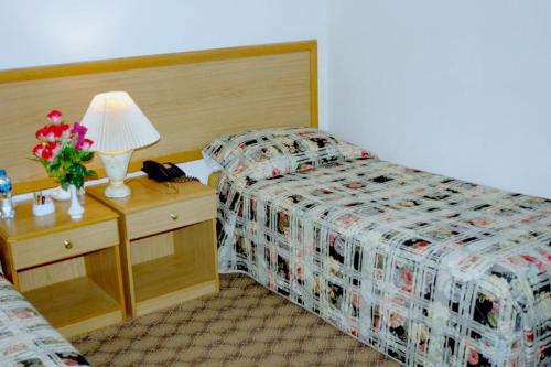 Krevet ili kreveti u jedinici u okviru objekta OYO 142 Al Sharqiya Sands Hotel