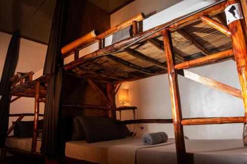 a couple of bunk beds in a room at Ohlala Hostel in Moalboal
