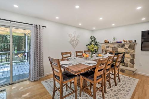 a dining room with a table and chairs at Game Room and Yard Family Paradise in Pocono Summit in Pocono Summit Estates