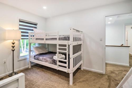 a white bunk bed in a room with a mirror at Game Room and Yard Family Paradise in Pocono Summit in Pocono Summit Estates