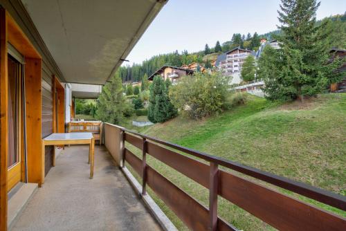 a balcony of a house with a view of a hill at Appartement Bellevue 527 in La Tzoumaz