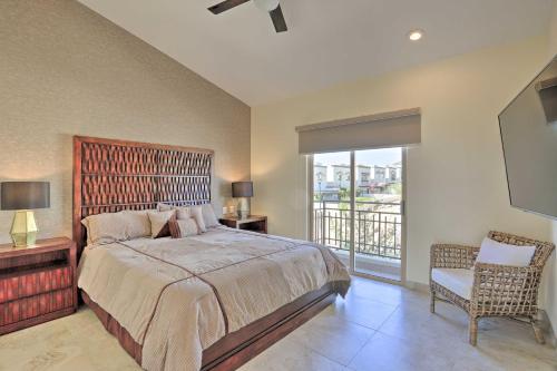 a bedroom with a large bed and a balcony at Luxe Cabo Casa w/ Own Rooftop Patio + Pool Access! in Cabo San Lucas