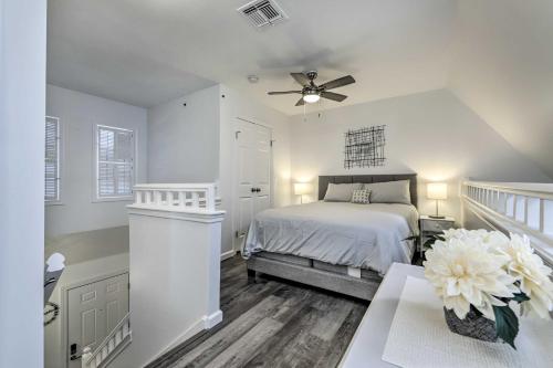 a white bedroom with a bed and a ceiling fan at Norwich The Villas Near Mohegan Sun Casino in Norwich