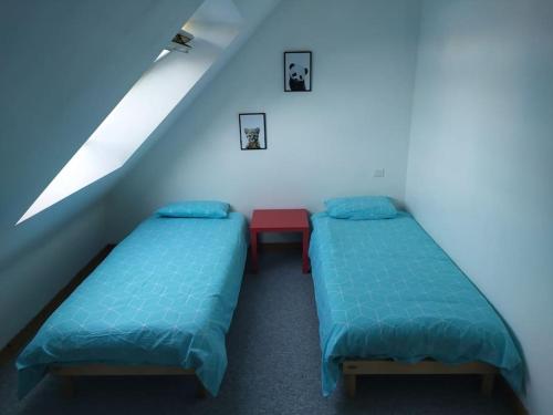 Llit o llits en una habitació de Maison 6pers, proche océan et plages, Moelan sur Mer