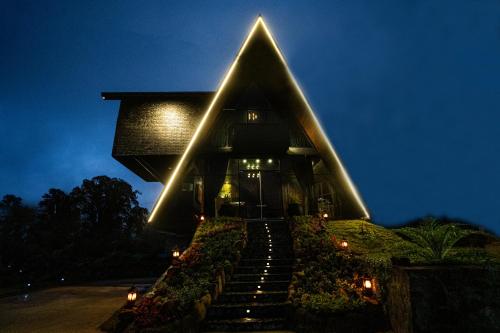 a building with stairs leading up to it at night at The Edgware Cabana in Nuwara Eliya