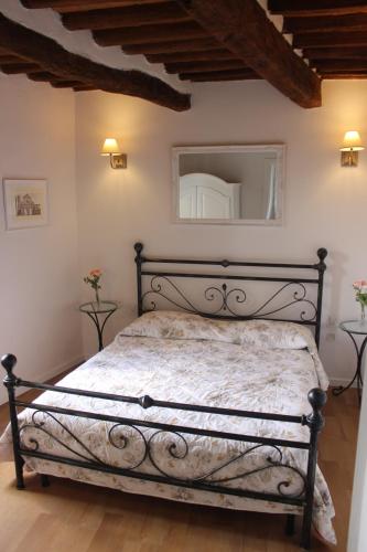 a bedroom with a bed in a room at San Bartolomeo Apartment in Pistoia