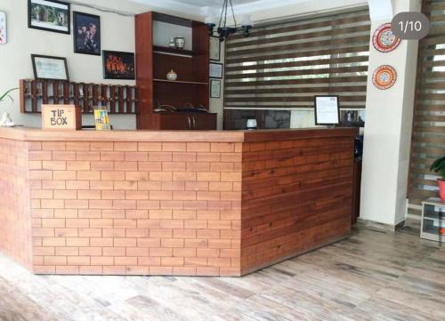 a restaurant with a brick counter in a room at Akay Hotel in Selcuk