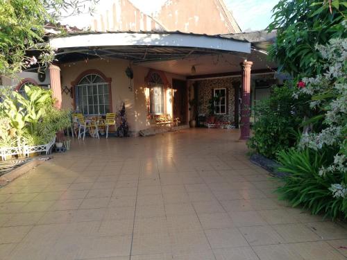 a porch of a house with a patio at Love homestay CT in Kangar