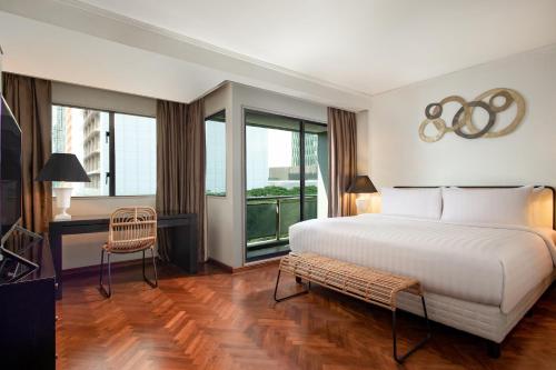 Katil atau katil-katil dalam bilik di Oakwood Suites Kuningan Jakarta