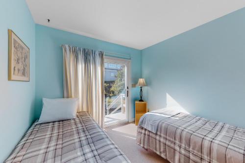 Ένα ή περισσότερα κρεβάτια σε δωμάτιο στο Lobster Cove Cottage