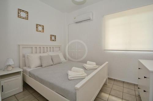 Ένα ή περισσότερα κρεβάτια σε δωμάτιο στο Vasiliki