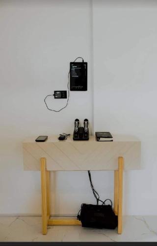 a table with a phone and phones on it at Check out this beautiful 5 bed villa with pool!! in Baclayon