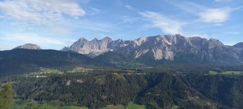 an aerial view of a mountain range with trees at Hotel Pension Berghof in Schladming
