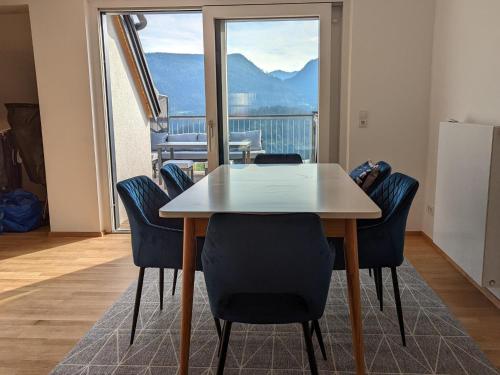 a table and chairs in a room with a balcony at Apartment in Mariazell near Ski Slopes in Mariazell