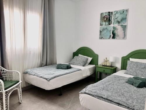 Posteľ alebo postele v izbe v ubytovaní CASA RENE, lovely apartment close to the center, Puerto del Carmen