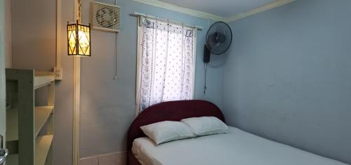 Postel nebo postele na pokoji v ubytování Khonesavane Hostel