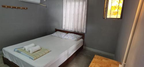 Postel nebo postele na pokoji v ubytování Khonesavane Hostel
