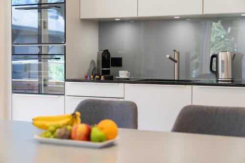 Kuchyň nebo kuchyňský kout v ubytování Moderne Neubauwohnung in Wilderswil