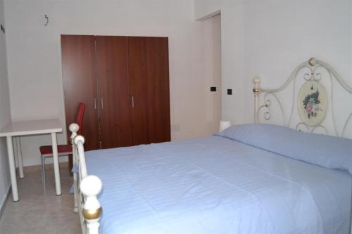 A bed or beds in a room at B&B La tarentilla