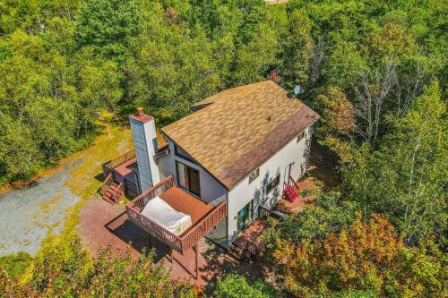 an overhead view of a house with a roof at House in the Woods in Albrightsville