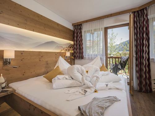 Postel nebo postele na pokoji v ubytování Apart Central – Premium Mountain&Garden