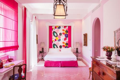 Katil atau katil-katil dalam bilik di Boutique Hotel Don Alfonso 1890