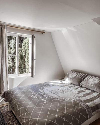 a bedroom with a bed and a window at Holiday Home Amila in Visoko