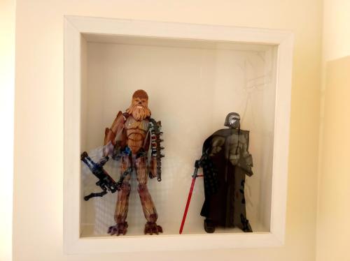 a room with two marvel figurines in a box at La Casa de las Nereidas in Cuenca