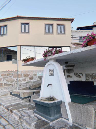 a house with a stairs leading up to a building at Casa dos Avós in Castelo de Paiva