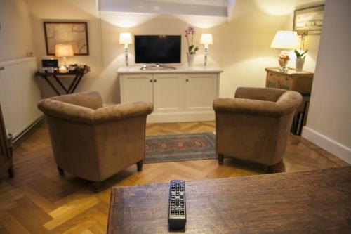 Televisyen dan/atau pusat hiburan di B&B De Schiedamse Suites